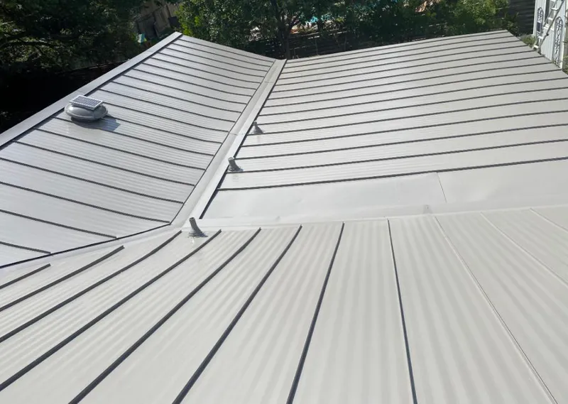 Solar attic fan installed on a metal roof for Roof Ventilation in Fort Myers Shores